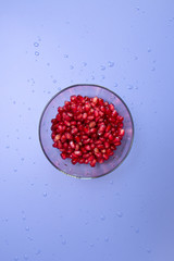 pomegranate seeds in glass bowl