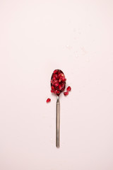 pomegranate seeds on a red background