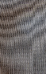 Close-up of light furniture fabric surface. High resolution full frame textured background.