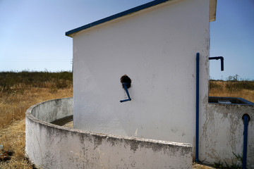 Old hand-operated drinking water fountain in Portugal