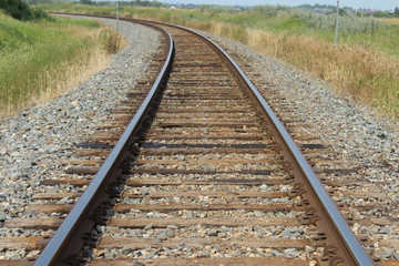 Fototapeta na wymiar Railway curve in the countryside