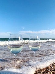 glass of champagne on the beach
