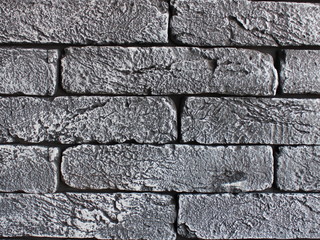 neat gray brick wall in cracks texture background