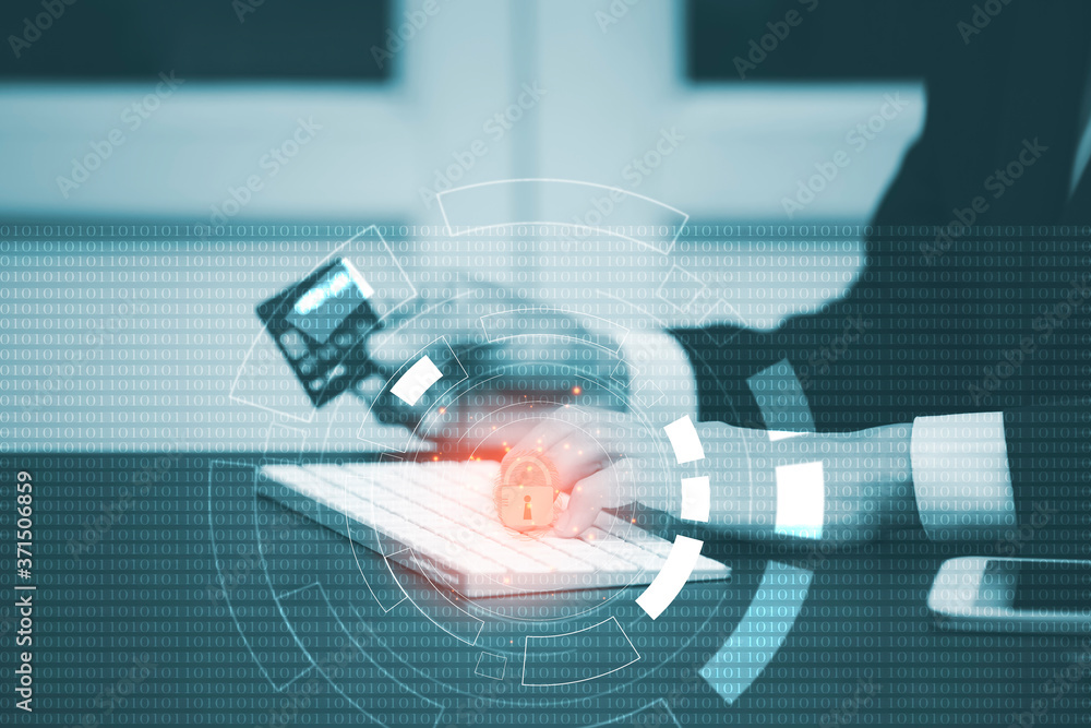 Poster businessman hacker is using a hand typing keyboard and uses a modern credit card by laptop screen ha