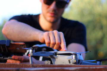 Stock photo of unrecognizable man setting up the drone
