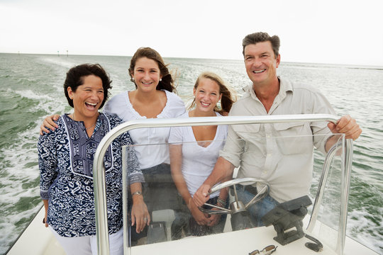Smiling family boating outdoors
