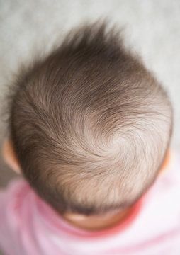 Close up of mixed race baby girl's hair