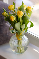 Beautiful bouquet of flowers: yellow tulip, daffodils, chamomile. colorful spring flowers background. Blooming flowers concept. Happy mother's day