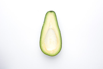 Half Avocado on a white background top view.