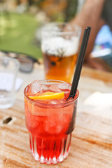 Aperol. Traditional Italian cocktail. Summer drinks concept. A glass with a straw. Soft focus. 