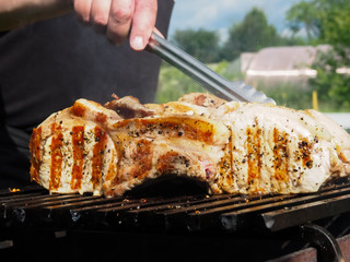 pork steaks on the grill. grill strips on a piece of meat.
