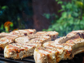 roasting steaks on the fire.flambé.flamber.meat on the bone on the grill.