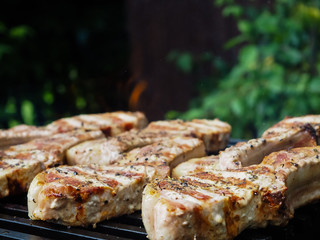 roasting steaks on the fire.flambé.flamber.meat on the bone on the grill.