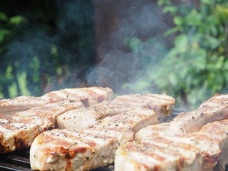 roasting steaks on the fire.flamb&eacute;.flamber.meat on the bone on the grill.