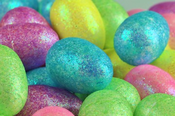 Fototapeta na wymiar Glitter and colorful Easter eggs
