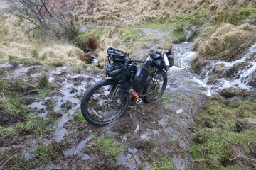 Fototapeta na wymiar bikepacking through a bog in Wales. 