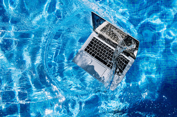 High angle view of computer floating on swimming pool