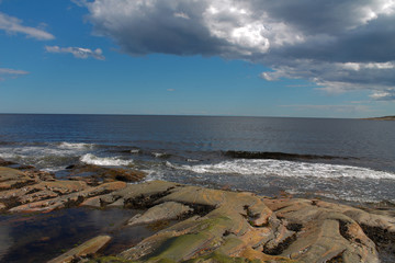 white sea, rocky coast