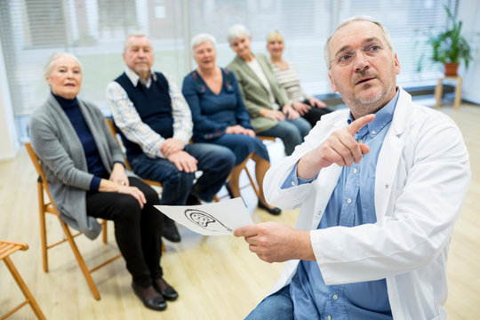 Group of seniors attending health counselling in retirement home