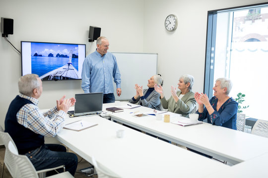 Group of active seniors attending seniors education course