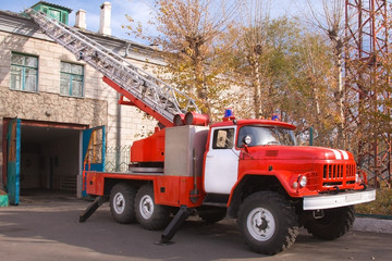Fototapeta premium A large soviet red fire truck is preparing to leave.
