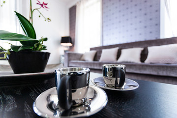 Close-up view of tea cups on table