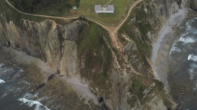 Coast in Asturias,Spain. Beach and cliffs in Busto Cape. Aerial Drone Footage