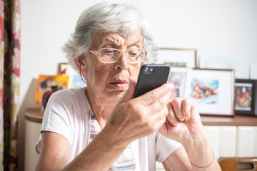 An elder lady using a smartphone
