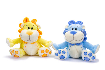 Stuffed blue and yellow lions with shadow