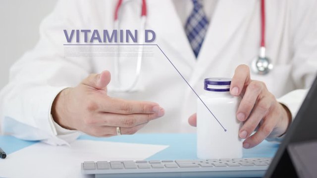 Doctor describing some a generic VITAMIN D to a patient