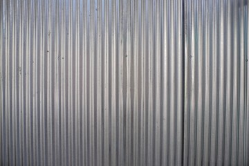 Pattern on a shiny steel plate and is often used as a barrier to a building project.