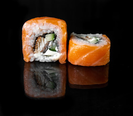 rolls with reflection on black background, photo for menu design