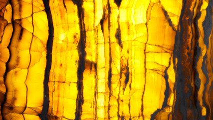 Translucent yellow marble onyx. Backlit alabaster texture