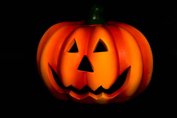 halloween! bright yellow pumpkin on black background