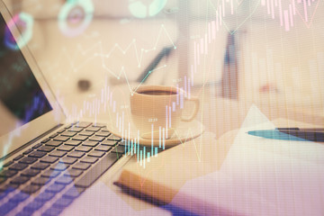 Fototapeta na wymiar Double exposure of financial chart drawing and desktop with coffee and items on table background. Concept of forex market trading