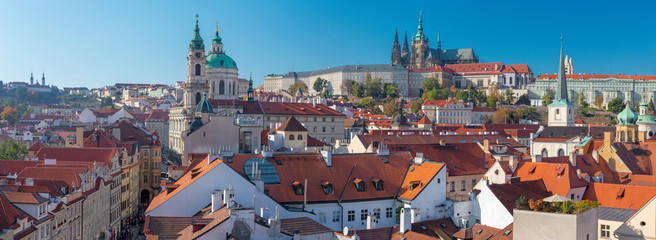 Naklejka na ściany i meble Prague - The roofs of Mala Strana with the St. Nicholas church, Castle and the Cathedral.