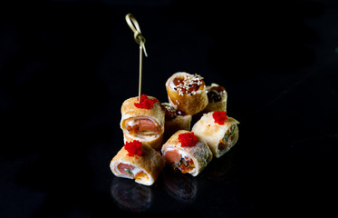 rolls in perspective, isolated on black background, food photography for design