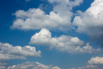Naklejka na ściany i meble Beautiful blue sky and white fluffy clouds.