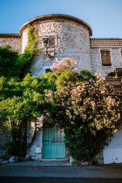 The medieval village of Ruoms with its old brick houses and small alleys on the Ardeche River in France. Europe