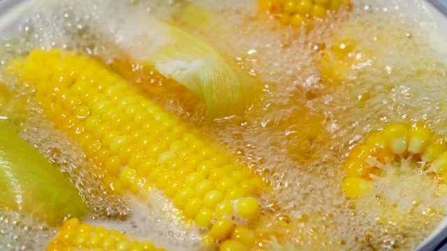corn is cooked in boiling water. slow motion