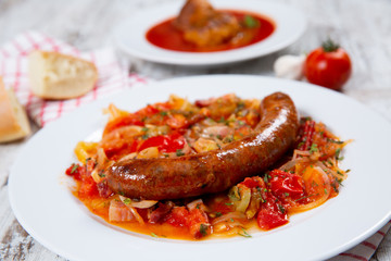 Sausage with vegetables on a plate