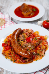 Sausage with vegetables on a plate