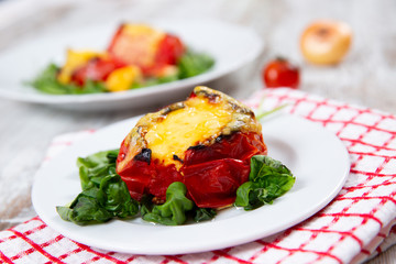 Stuffed tomatoes. Tomatoes baked with cheese and meat