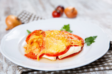 Sliced tomatoes and cheese and baked