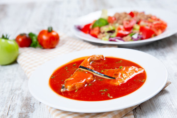 Fish soup in a white plate