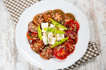 Salad tomato with cheese and paprika