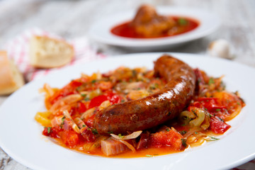 Sausage with vegetables on a plate
