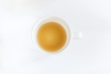 White half-empty coffee cup on white background, isolated, close up, above vantage point photography
