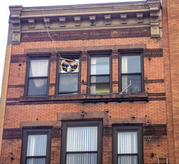 decayed brick facade building with repairs