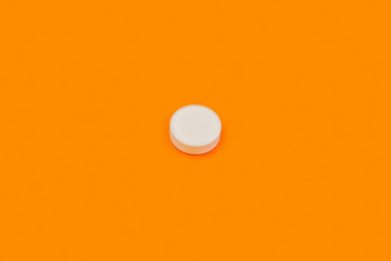 White pill on orange background. White pill on yellow background. Orange seamless pattern and white pill.